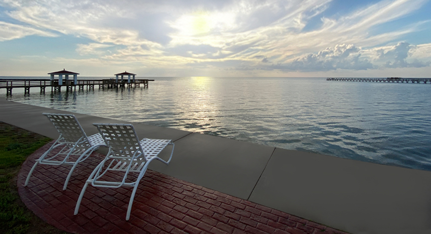 The bay view photographed during the "golden hour" behind the Lighthouse Inn, Rockport, Texas.